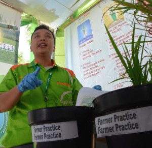 A training staff explains rice planting methods to local farmers at Syngenta AG’s training center in the suburb of Jakarta.