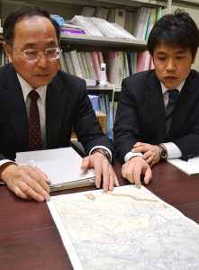 Officials of Nishigo, Fukushima Prefecture, show a map to explain about the land obtained by a foreign firm.