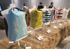 “KOMECTION 2014” is a display of colorful rice bags.