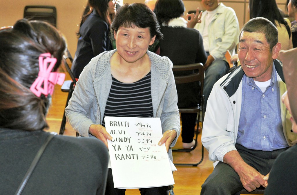 Kikou, 65 , and Reiko, 59, Kawai holding list of nicknames for their students at first gathering.