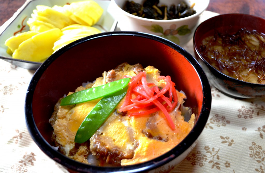 Bowl of rice topped with Abura-fu cooked in mouth-watering sweet-salty soup broth.