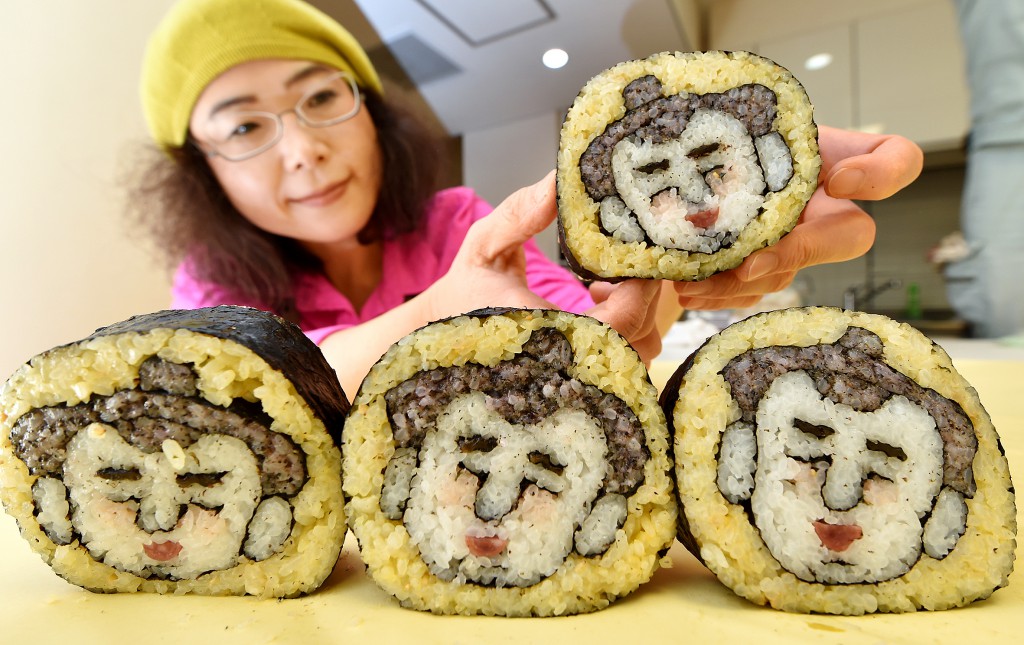 Takayo Kiyota and her makizushi artwork that shows faces of sumo wrestlers, which are all slightly different depending on where it’s cut. (in Minato-ku, Tokyo)