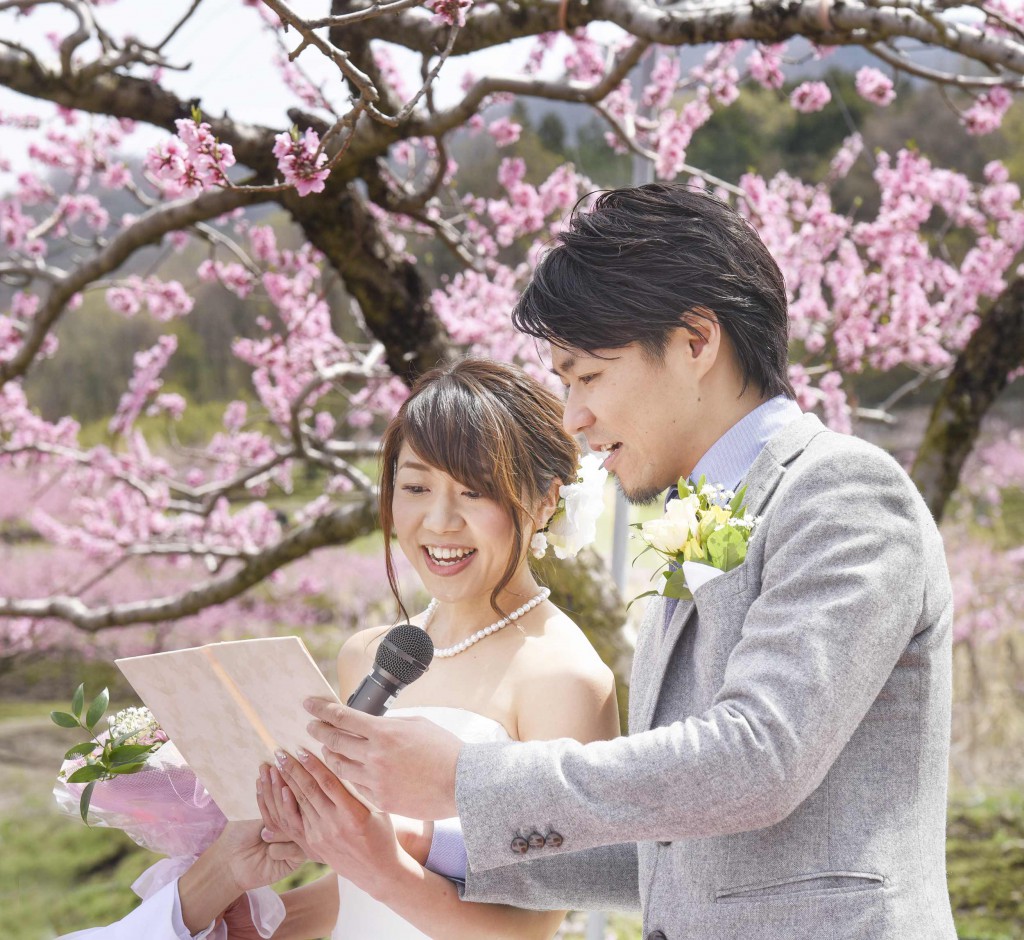 Jumpei and Akina pledging undying love in front of peach tree in full bloom