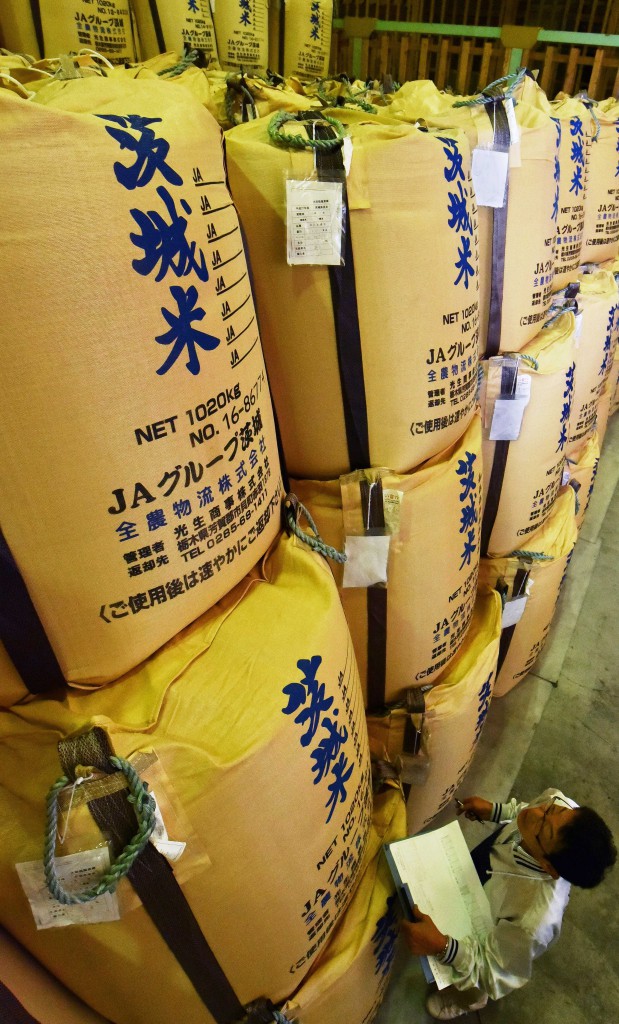 Koshihikari brand rice bags are piled up in a warehouse of JA Kitatsukuba in Chikusei, Ibaraki Prefecture